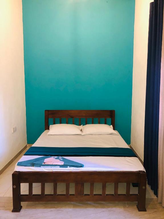 Postel nebo postele na pokoji v ubytování Kottamba Villa Tangalle