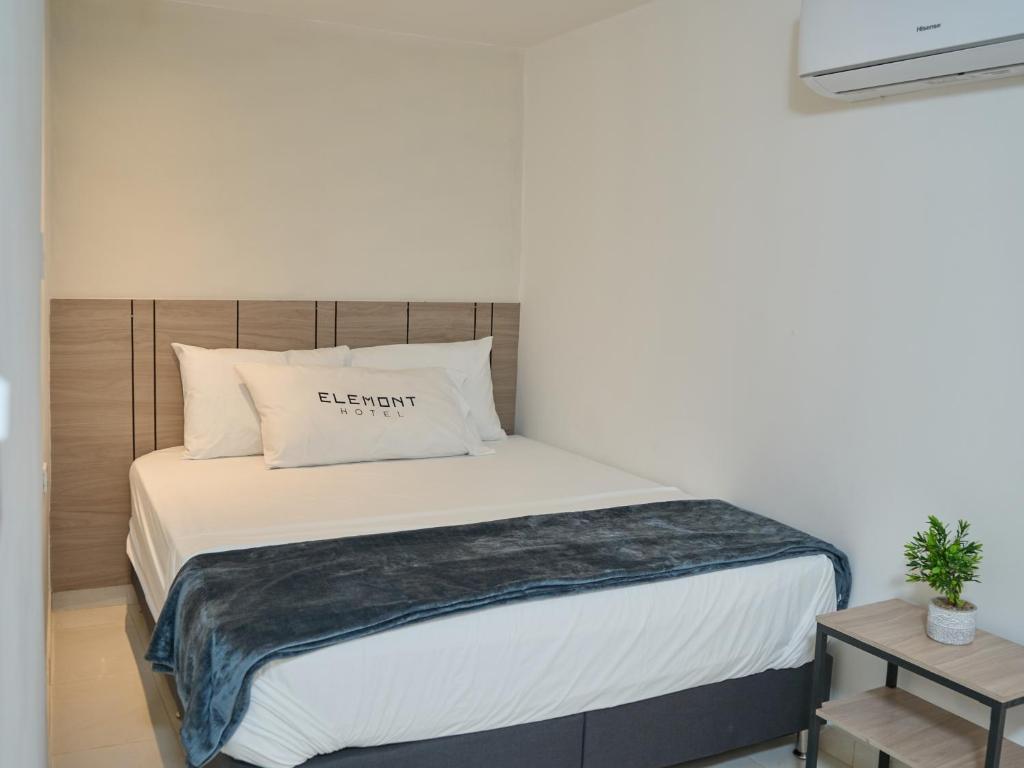 Postel nebo postele na pokoji v ubytování Elemont Hotel