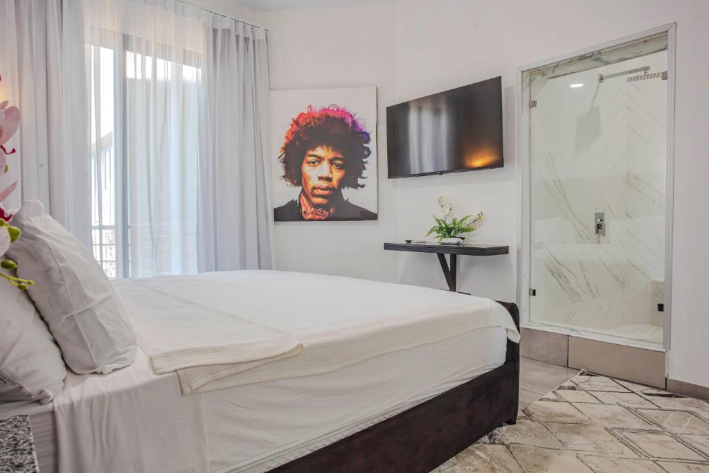 Postel nebo postele na pokoji v ubytování Instyle Residences at RIZZ SUITES