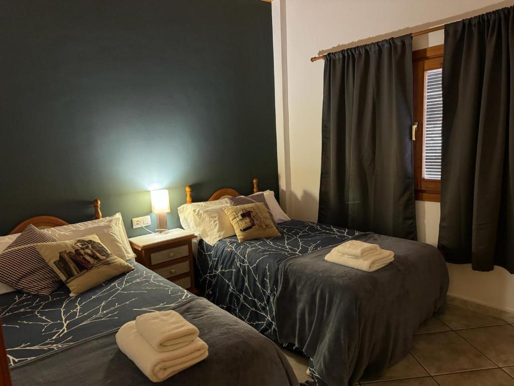 Postel nebo postele na pokoji v ubytování La Fusteria del Casat