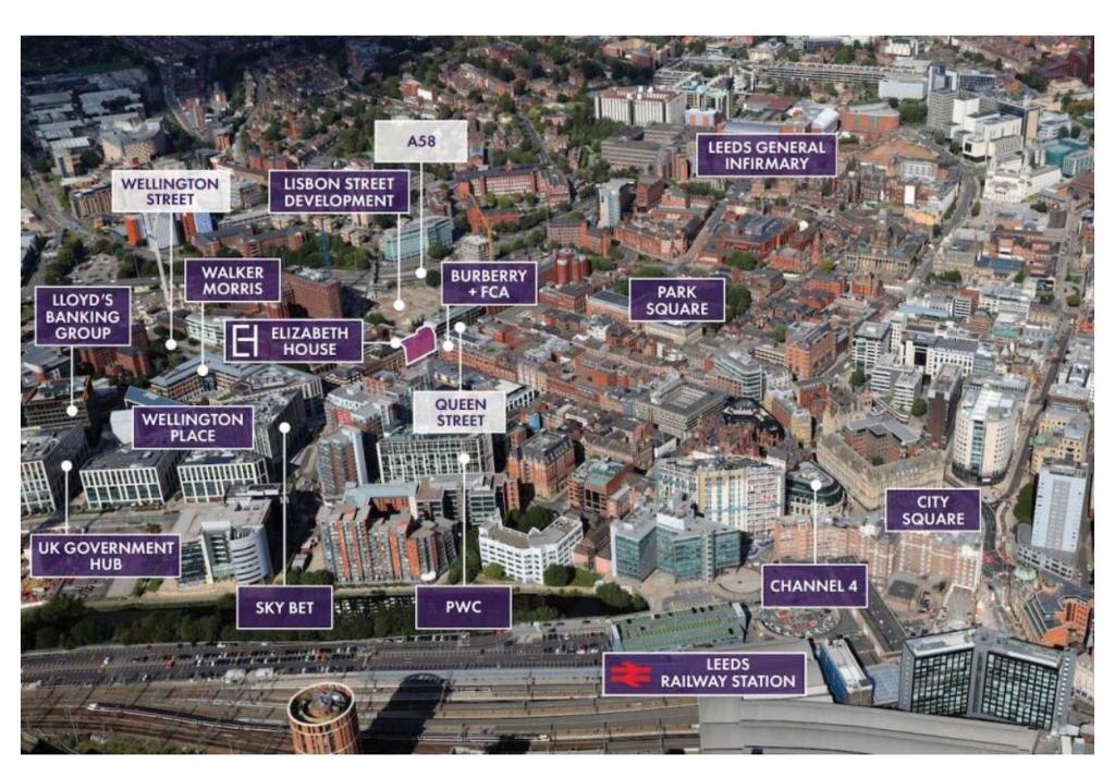 an overhead view of a city with purple signs at Ideal for Professional Staff in LS1 Financial Hub in Leeds