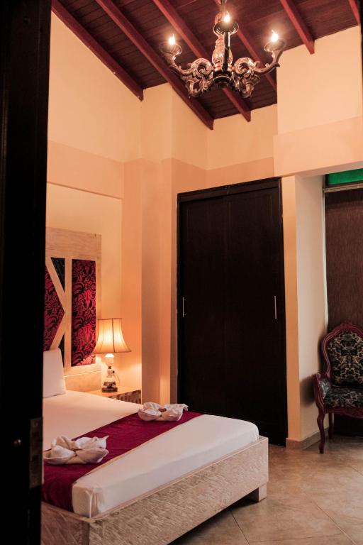 Postel nebo postele na pokoji v ubytování Hotel Plaza Garibaldi