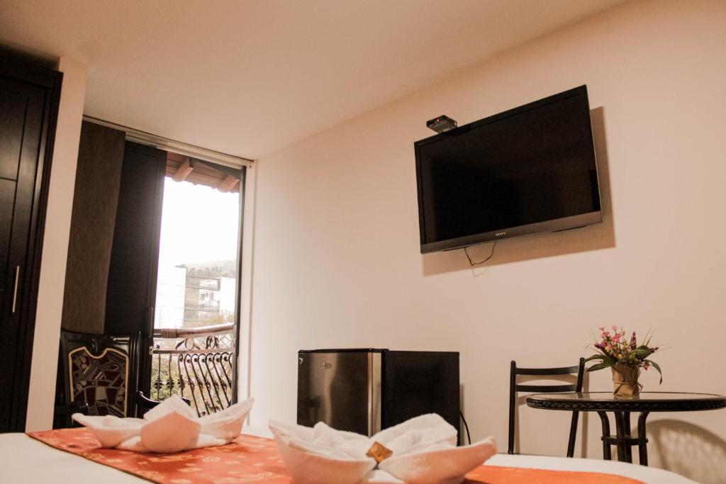 TV a/nebo společenská místnost v ubytování Hotel Plaza Garibaldi
