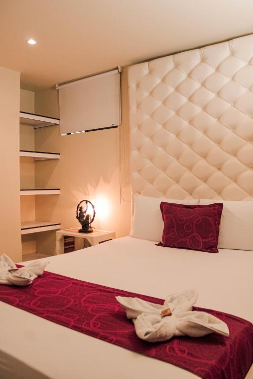 Postel nebo postele na pokoji v ubytování Hotel Plaza Garibaldi
