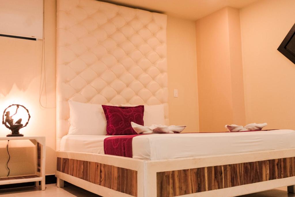 Postel nebo postele na pokoji v ubytování Hotel Plaza Garibaldi