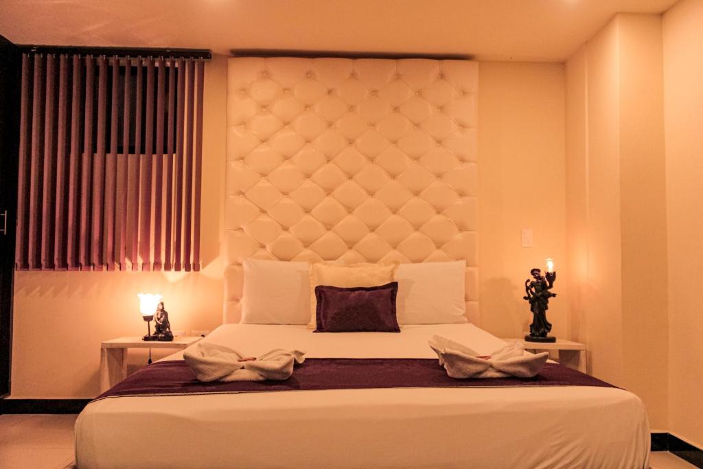 Postel nebo postele na pokoji v ubytování Hotel Plaza Garibaldi