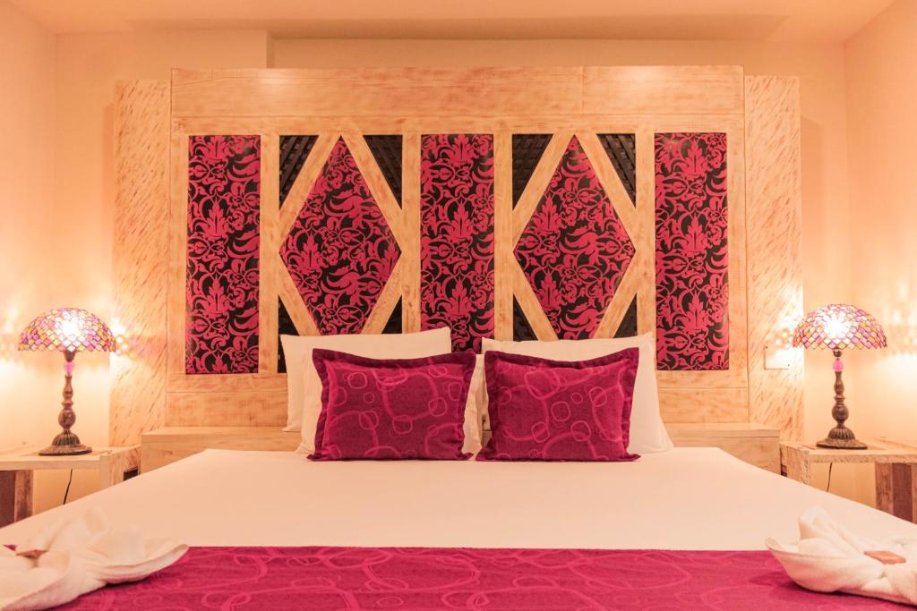 Postel nebo postele na pokoji v ubytování Hotel Plaza Garibaldi