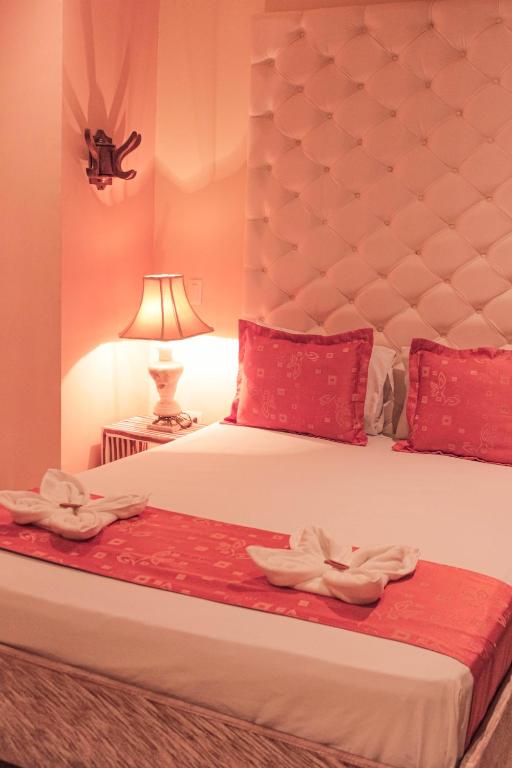 Postel nebo postele na pokoji v ubytování Hotel Plaza Garibaldi