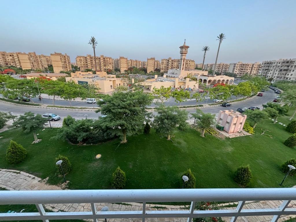an aerial view of a city with a park at Luxury Inn: 3BR Amazing View in Madinaty B6 in Madinaty