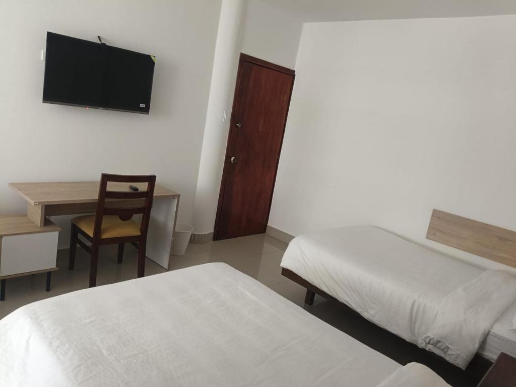 Postel nebo postele na pokoji v ubytování HOSPEDAJE BOGOTA CENTRO
