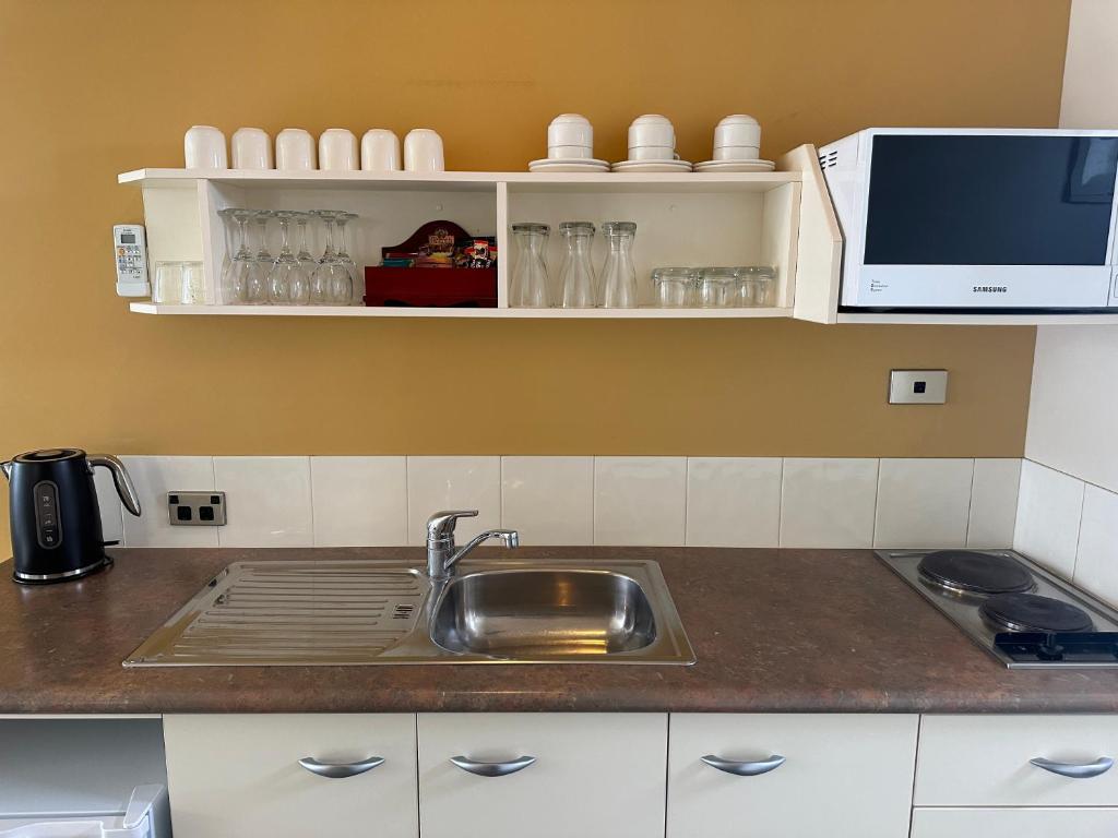 Kuchyň nebo kuchyňský kout v ubytování Ballina Motel