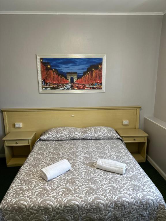 Postel nebo postele na pokoji v ubytování Nuova Locanda Belvedere