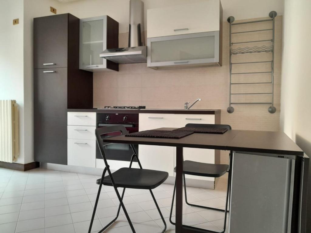 Kuchyň nebo kuchyňský kout v ubytování Apparthotel Oleggio