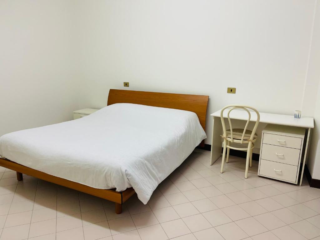 Postel nebo postele na pokoji v ubytování Apparthotel Oleggio