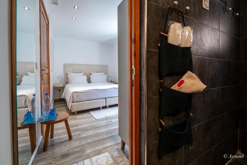 Postel nebo postele na pokoji v ubytování La Petite Chefchaouen