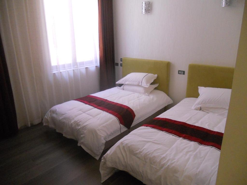 Postel nebo postele na pokoji v ubytování Igiban Hotel