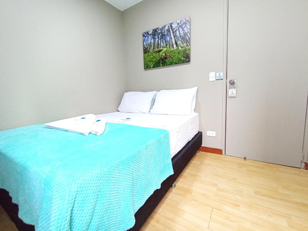 Postel nebo postele na pokoji v ubytování Poblado Park Guest House