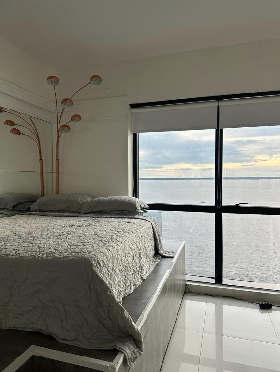 Postel nebo postele na pokoji v ubytování Tropical Executive Hotel N 925