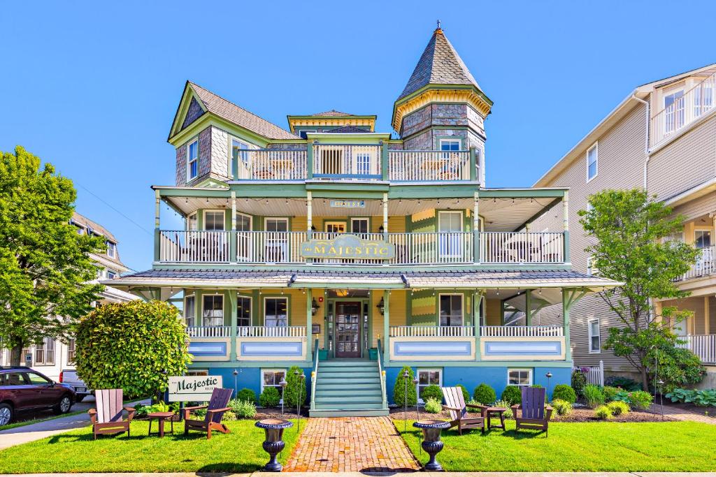 a large house with a balcony on top of it at Majestic Hotel in Ocean Grove