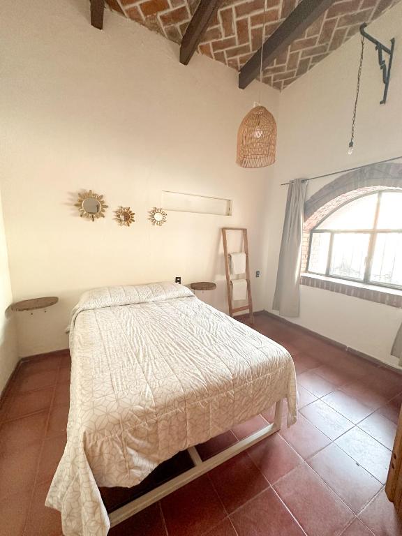 Postel nebo postele na pokoji v ubytování Mini depa Bernal
