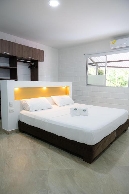 Postel nebo postele na pokoji v ubytování Hotel Boutique Campestre