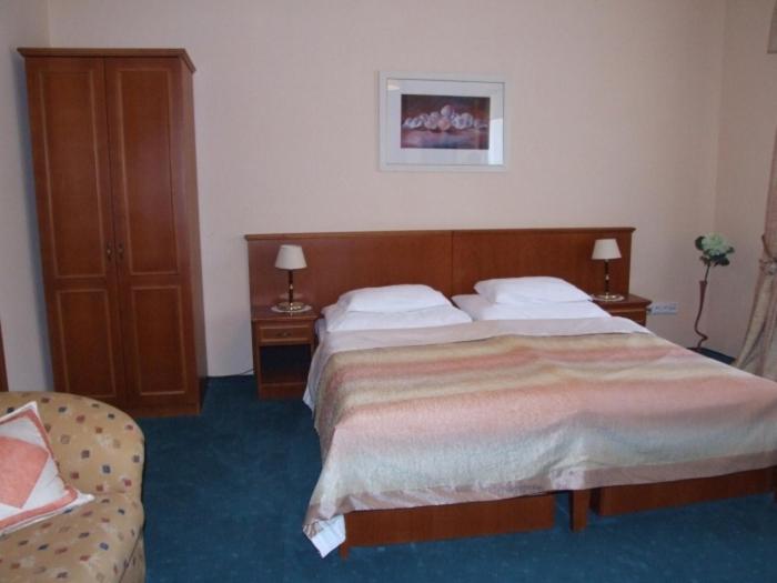 Postel nebo postele na pokoji v ubytování Penzion 77 - Garni