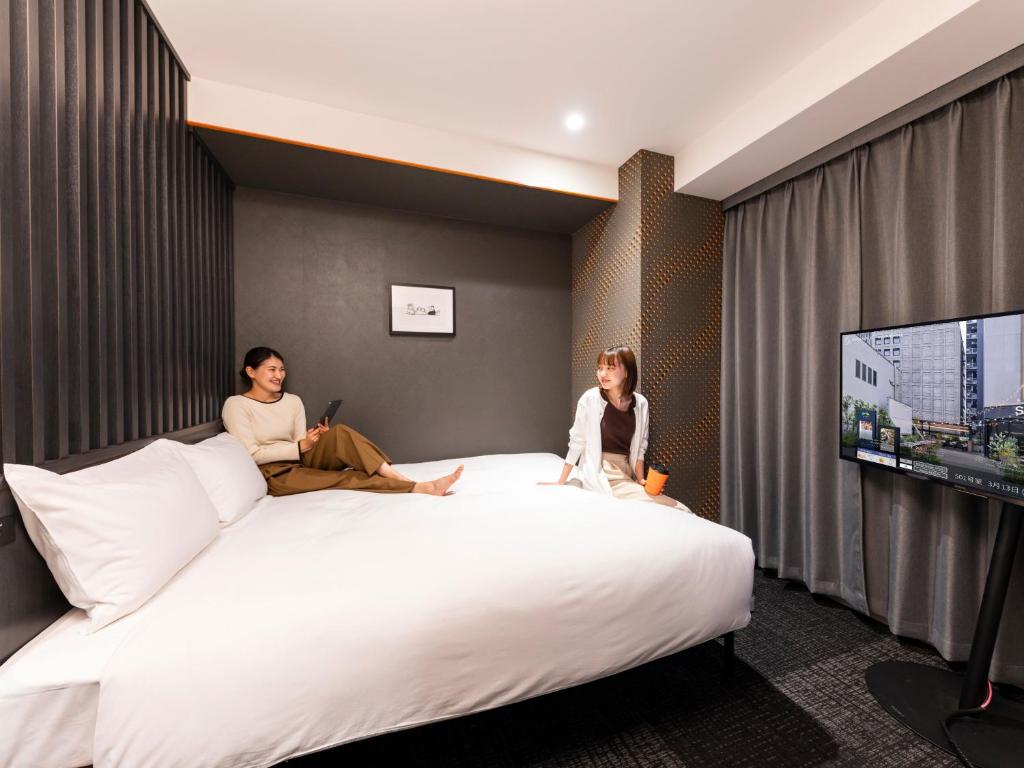 Postel nebo postele na pokoji v ubytování sequence SUIDOBASHI - Tokyo