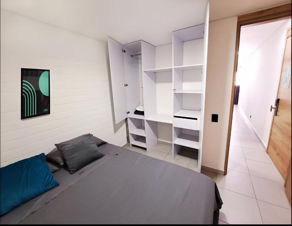 Postel nebo postele na pokoji v ubytování INVERSO Coliving