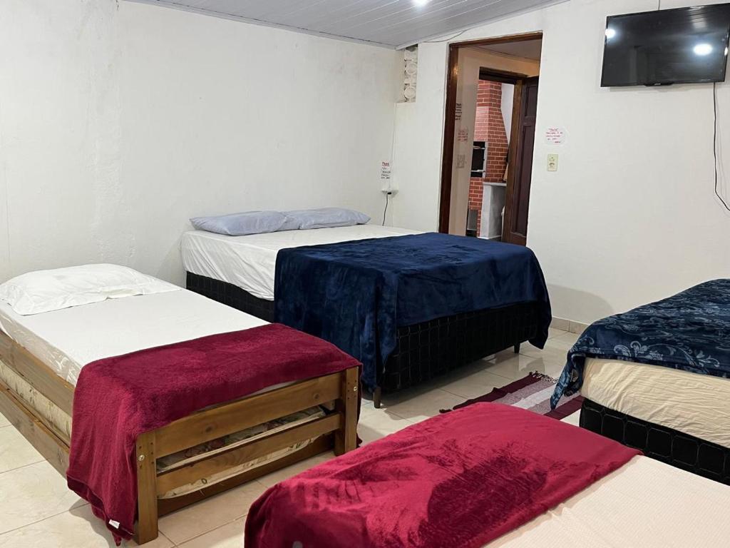 Легло или легла в стая в Casa de Praia Caraguatatuba -500 metros da Praia Porto Novo