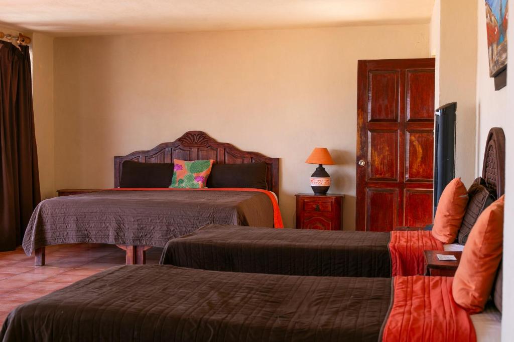 Postel nebo postele na pokoji v ubytování Hotel Chocolate Suites