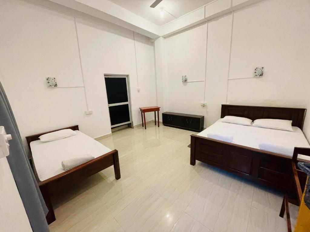 Postel nebo postele na pokoji v ubytování ZIMBAY Guest House