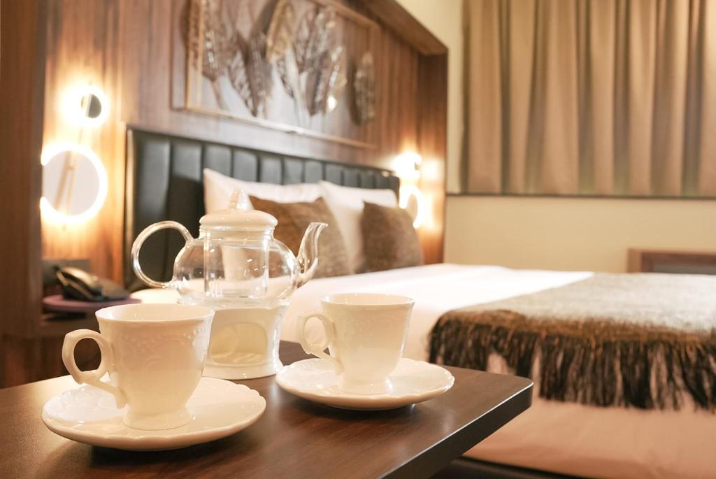Postel nebo postele na pokoji v ubytování Oak Tree Urban Hotel Jakarta