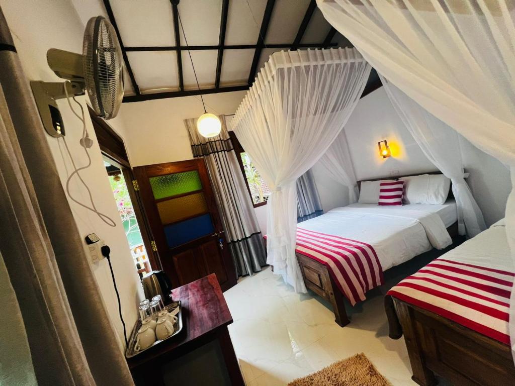 Postel nebo postele na pokoji v ubytování Rest Full Homestay