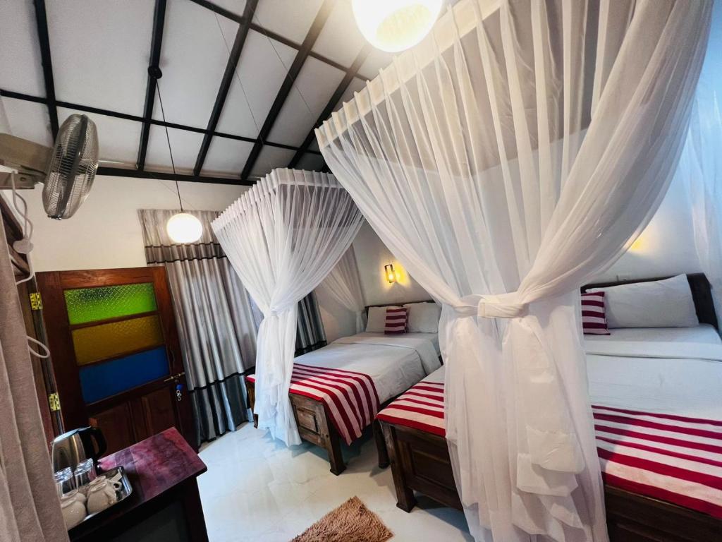 Postel nebo postele na pokoji v ubytování Rest Full Homestay
