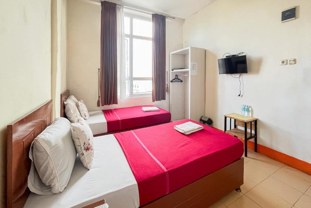 Urbanview Poma Hotel - Camera Gemella Standard