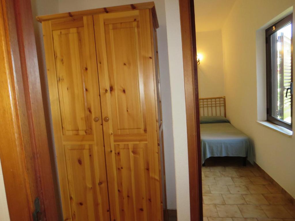 A bed or beds in a room at Villetta Sunrise 35