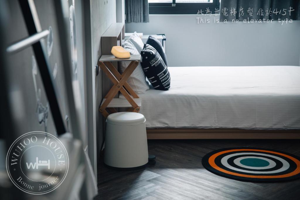 Postel nebo postele na pokoji v ubytování Wuhoo House