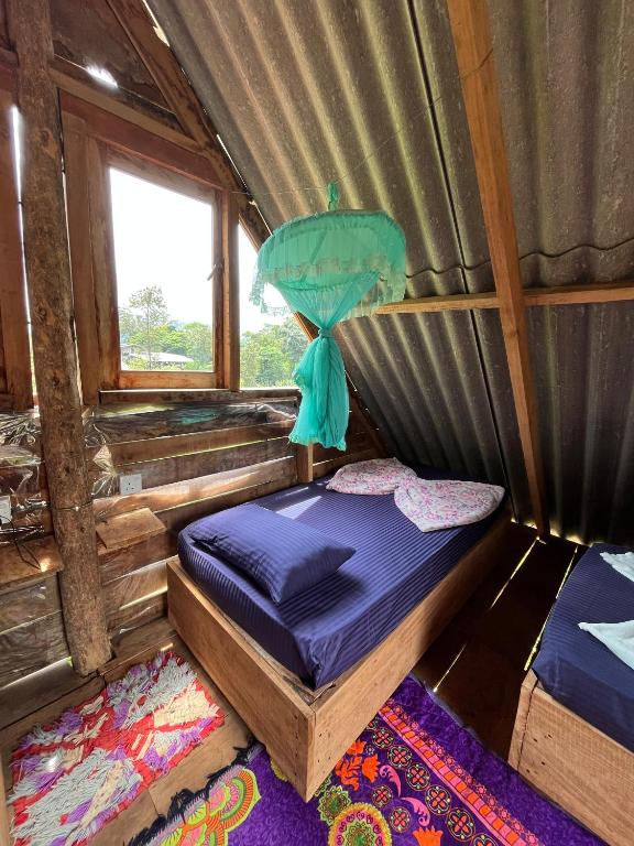 Postel nebo postele na pokoji v ubytování Backpackers Hostel