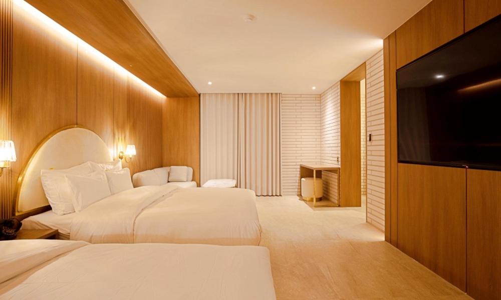 Postel nebo postele na pokoji v ubytování Hotel Ippda Gumdan