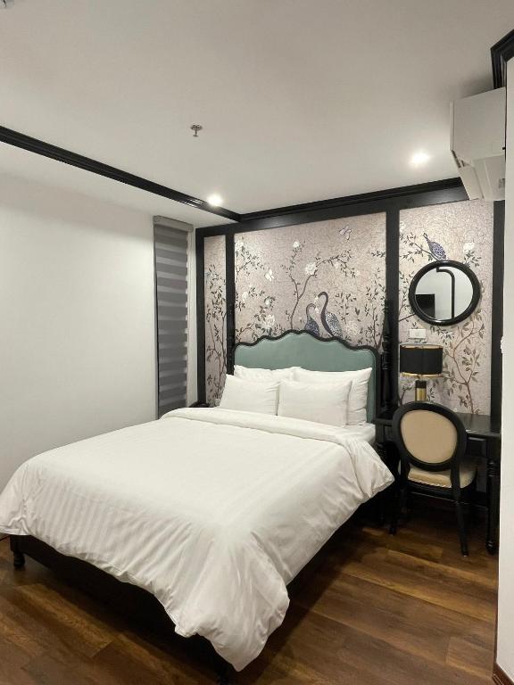 Postel nebo postele na pokoji v ubytování Aquarius Premium Hotel