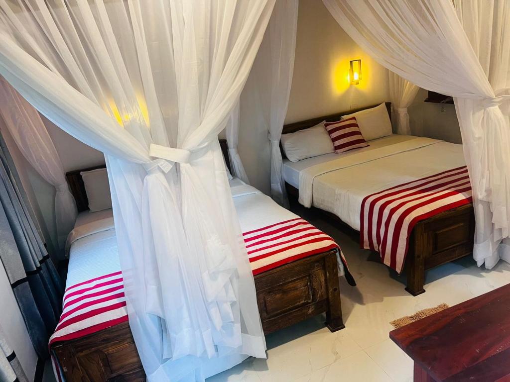 Postel nebo postele na pokoji v ubytování Rest Full Homestay