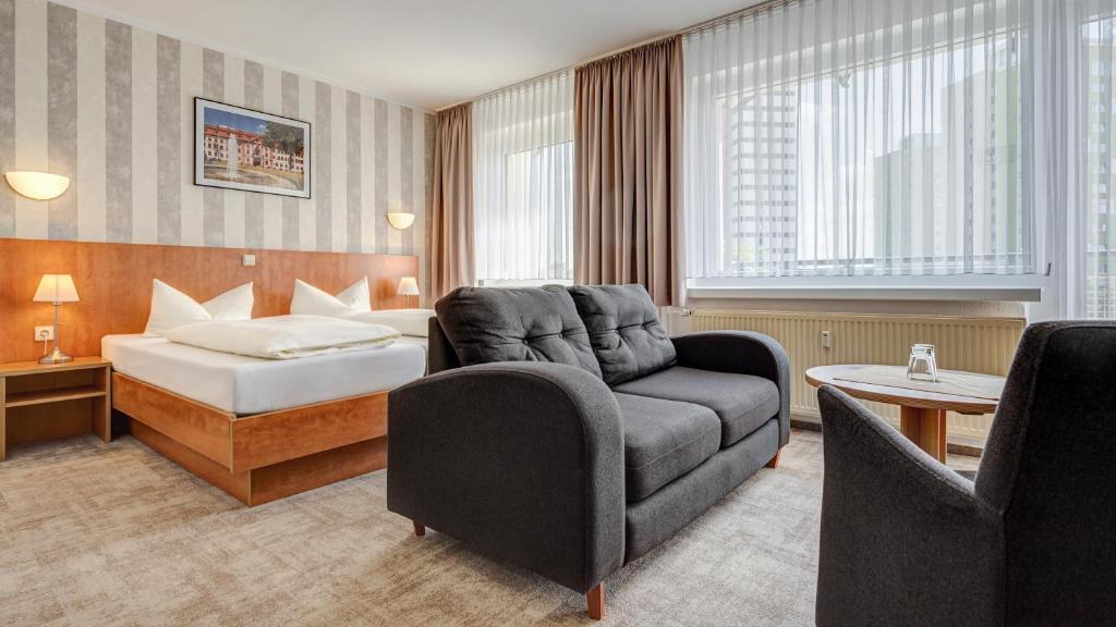 Postel nebo postele na pokoji v ubytování Hotel Wilna