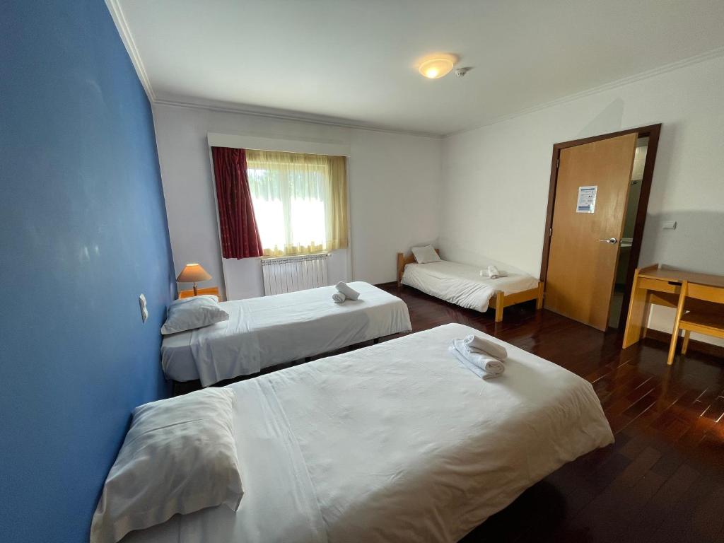 Cama ou camas em um quarto em HI Bragança – Pousada de Juventude