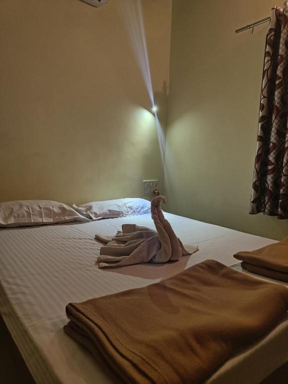 Postel nebo postele na pokoji v ubytování Konkan Villa Dream