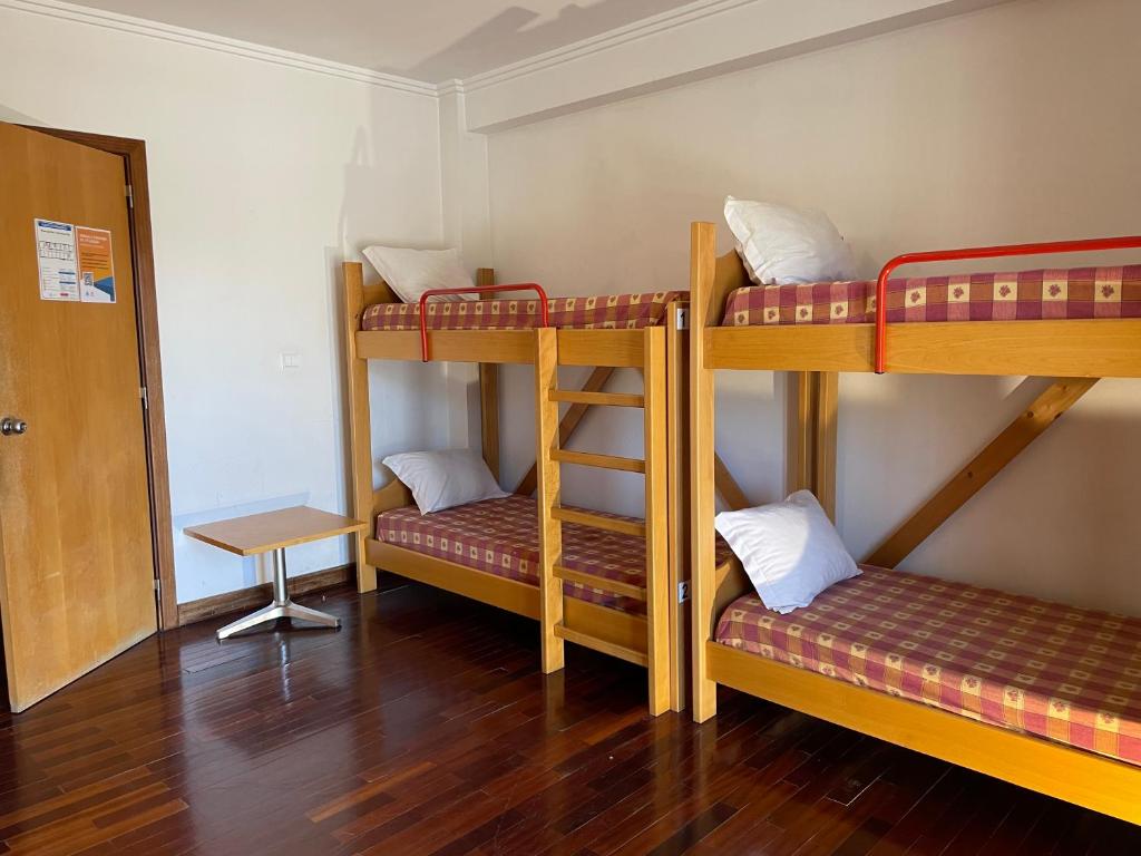 Cama ou camas em um quarto em HI Bragança – Pousada de Juventude