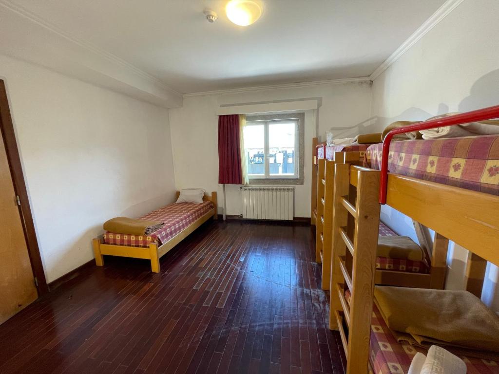 Cama ou camas em um quarto em HI Bragança – Pousada de Juventude