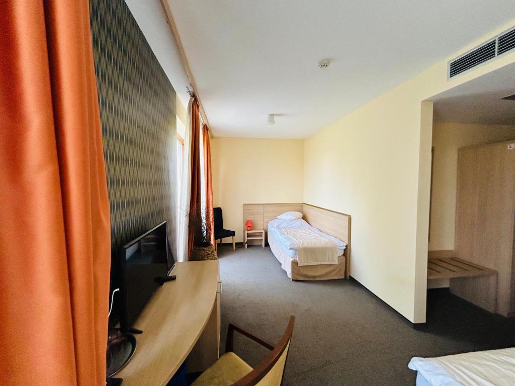 TV a/nebo společenská místnost v ubytování Hotel Legend