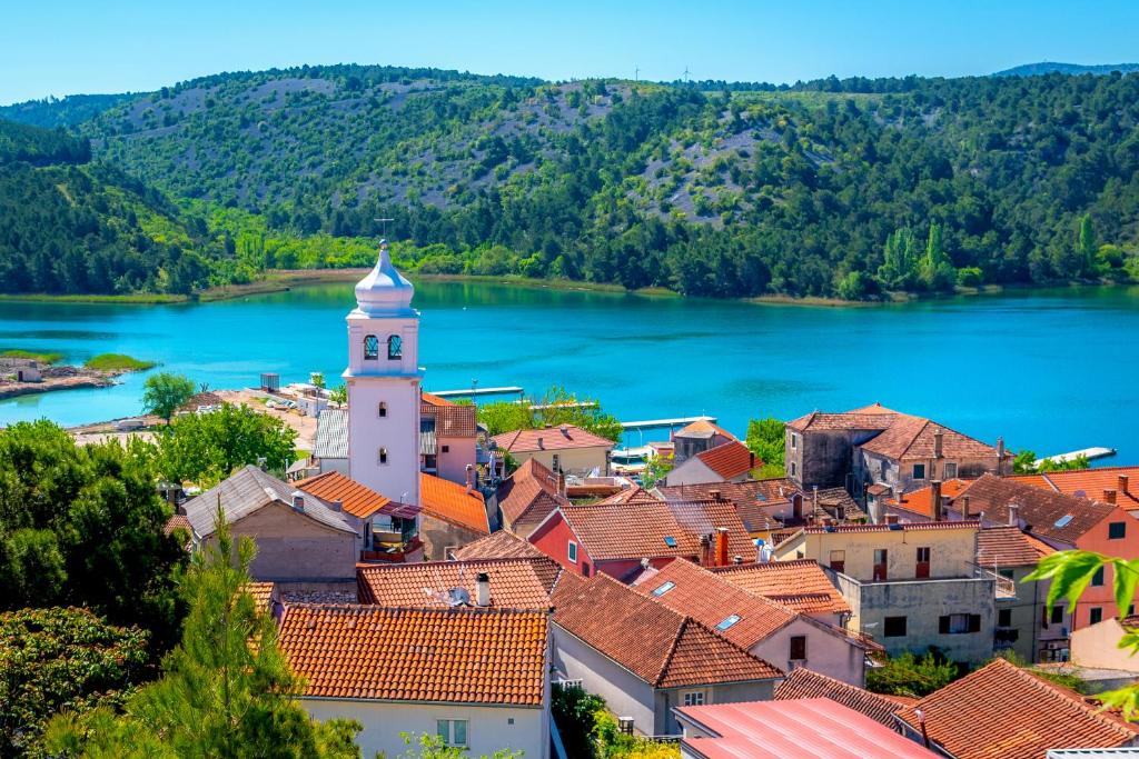 a view of a small town with a lake at Guest Accomodation Žura in Skradin