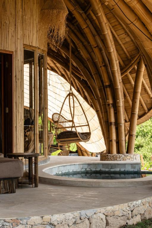a pavilion with a round pool in a building at Villa Cecilia Luxury with Sea view Pool - ANIMA Eco Lodge in Selong Belanak