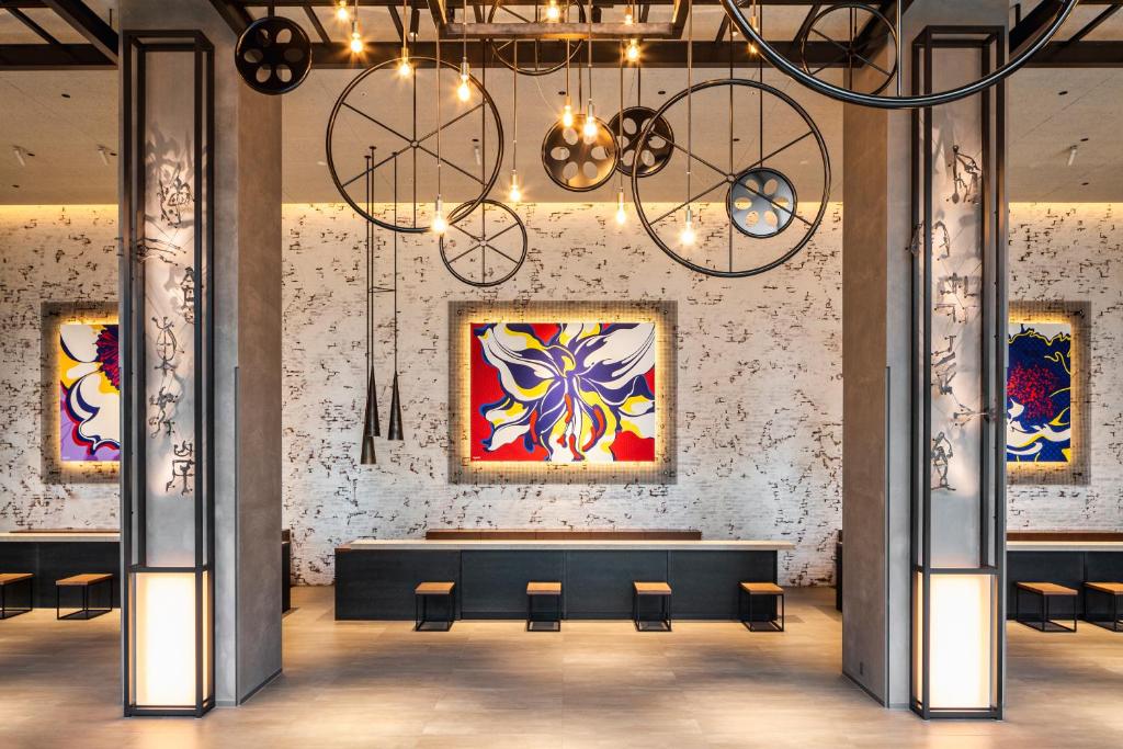 a large room with chairs and paintings on the wall at Tokyo Bay Shiomi Prince Hotel in Tokyo